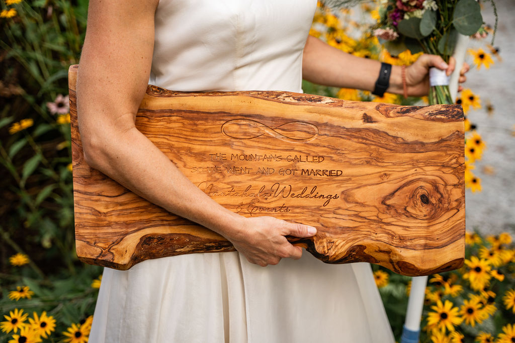 Woodproshop from Etsy donated NANTAHALA WEDDINGS many charcuterie boards and we are so grateful that we decided to make these board, engraved of course with the couples names on it and the date of the wedding dress challenge, as a prize for any one who takes on the challenge and completes it within the guidelines