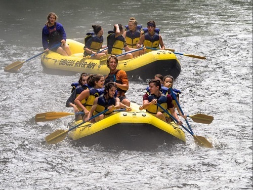 Stand up paddleboarding in a wedding dress is something you don't see every day. But every once in a while you can catch a bride completing the wedding dress challenge at nantahala wedding & events on her leg two she circumvents the Nantahala lake's treasure island just off wine spring creek beach.
