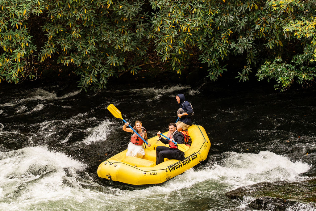 Wedding dress challenge during the white water rafting stage of the challenge with Jenni and Austin.